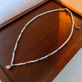 Detail of beaded aquamarine necklace with gold pendant on vintage wooden tray - 38# Necklace - Gold White Single Diamond