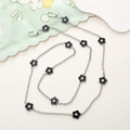 Detail of silver irregular metal chain strap with black floral charms and spring clasps - Plum Blossom Crossbody Chain / Plum Blossom Crossbody (K887)