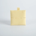 Macro shot of square beige microfiber jewelry insert pad with delicate velvet texture - 6*6cm / Yellow