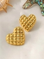 Macro view of gold heart stud earrings with quilted texture on white silk background - Quilted Heart Design