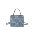Denim checkerboard crossbody bag with fringe star patterns and top handles on white background - Star Blue