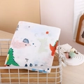 Muslin cotton baby swaddle blanket with colorful dinosaur prints folded in a basket - Colorful Dinosaur