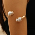 Gold baroque pearl open arm cuff featuring two irregular pearls and textured frames - Gold Double Pearl Baroque Arm Cuff