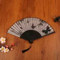 Chinese bamboo folding fan with black butterfly print and long silk tassel detail - Calligraphy Butterfly