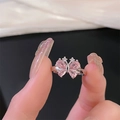Close-up of silver butterfly ring with pink gemstone wings and sparkling diamond accents - Adjustable Open / Pink Gemstone Butterfly Style (JZ4412)