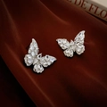 Elegant butterfly stud earrings with sparkling zircon on a dark red silk fabric backdrop - S925 Silver Needle Style / Silver