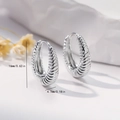 Detail view of silver twisted hoop earrings with 16mm height and 4.7mm width measurements - EH750 Silver Twisted Hoops / Silver
