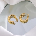 Close-up of golden bamboo texture hoop earrings on reflective mirror and white silk fabric - Gold Bamboo Texture Hoops
