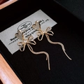Detail of golden heart earrings with sparkling bow ties and long chain tassels - Heart Shell Bowknot (12#)