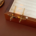 Detail of vintage flower earrings with tiger eye stone on gold plated spiral hooks - Four-Petal Flower Tiger Eye Drop Style