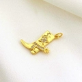 Gold cowboy boot pendant with sparkling star rhinestones on textured fabric background - Gold Rhinestone Cowboy Boot Charm