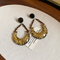 Detailed view of vintage gold-plated hoop earrings with tiger eye stone and resin foil - 22# Black Gold Foil Resin Earrings (22#)