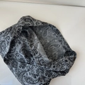 Detailed macro view of the grey paisley pattern on the linen tote bag surface - Shoulder Style / Black Gray Paisley