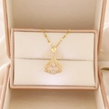 Detail of a fan-shaped gold necklace with a floating center stone in a jewelry box - Gold Fan Style (A-1347)