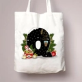 White canvas tote bag featuring Christmas letter Q design with festive holiday ornaments - Letter Q