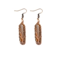 Detailed macro view of handmade tree of life wire wrapped tiger eye stone earrings - Tiger Eye