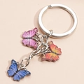 Colorful butterfly keychain with pink, orange, and blue enamel pendants on metal ring - Multicolor 1