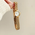 Elegant gold chain watch for women with a white mother-of-pearl dial by Scottie - All Gold