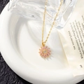 Detail of pink crystal flower pendant necklace on white plate with vintage book - Necklace (with Lips Chain) / Pink