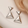 Minimalist silver geometric hourglass earrings displayed on elegant silk background - Double Halo Triangle / Silver