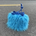 Top view of blue faux sheep fur bucket bag with PU leather drawstring on asphalt ground - Sky Blue