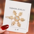 Gold snowflake hair clip with white rhinestones and iridescent center stone, size 5cm - Gold Snowflake