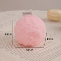 Pink sphere scented candle with floral reliefs on an open book, size 6.5x6.3cm - Macaron Pink Floral Sphere (White Peach Oolong)