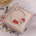 Detail of Christmas beaded bracelet with red glass beads and silver snowflake pendant - Bee Snowflake Style(6#)