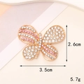 Macro shot of gold butterfly pin with pink crystals measuring 2.6cm by 3.5cm - D005 Pink & White Rhinestone Butterfly