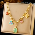 Detail of gold chain necklace with colorful heart, oval, and star pendants on a display - Colorful Heart Star Gem Style (N3226)