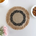 Handwoven round jute placemat with black laurel embroidery and decorative fringe trim - Type E Jute Coaster