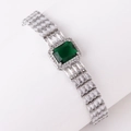 Luxurious wide bracelet featuring an emerald green zircon center and triple-row clear stones - Green Zirconia