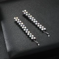Set of two silver hair clips with iridescent rainbow rhinestones on black leather background - AB Rhinestone Black Pair