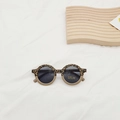 Close-up of leopard and beige round frame kids sunglasses with UV400 protection logo - Grey Leopard