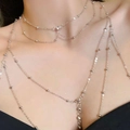 Detail view of multi-layered silver body chain with beads on model shoulder - 22401 Jewelry Set-Silver