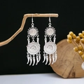 Ethnic silver-plated long tassel earrings with retro discs hanging on a wooden stand - Retro Disc Spiked Tassel Style (E4295)