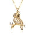 Golden owl pendant necklace with sparkling zircons and pearl accent on a reflective surface - Owl Shape (D574)