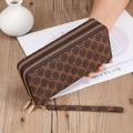 Detail of dark brown long wallet with GS monogram pattern and golden double zippers - SLW-204 Coffee