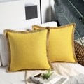 Detail view of yellow linen pillowcases with natural jute braided border on a white sofa - 30*50cm / Lemon Yellow