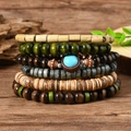 Set of 6 stacked bohemian wooden bead bracelets featuring turquoise accents and coconut shells - Turquoise 6-piece Set