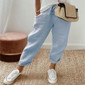 Close-up of light blue cotton linen pants with drawstring waist and textured fabric - S / Bottoms / Sky Blue