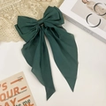 Detail shot of the dark green oversized bow hair clip with flowing chiffon ribbons - Dark Green