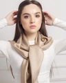 Champagne gold silk-feel large square scarf for women worn by a model in a minimalist setting - Camel