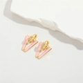 Detailed macro of pink enamel Evil Eye V-shaped earrings with gold plating and zircons - Pink