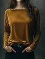 Detailed texture of velvet gold long sleeve top with elegant drape and round neck - S / Tops / Golden Yellow