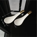 Two white ceramic soup spoons with gold-tipped handles and 14.5cm length dimensions - Gold Plated Small Soup Spoon 2Pcs