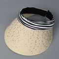 Macro shot of straw sun visor with rhinestones and black and white striped headband - M (56-58cm) / Beige