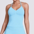Detail of light blue halter-neck sports top with V-neck pleats and seamless knit texture - Light Blue