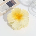 Macro detail of a bright yellow gradient flower hair claw clip with resin petals - Yellow