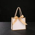 White premium gift paper bag with gold ribbon bow and metallic gold trim handles - 14x6x12cm / White Bag Gold Border + Gold Ribbon